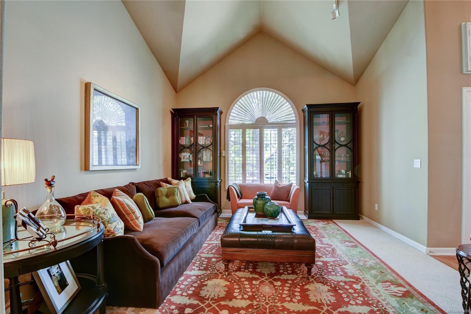 Living room in Highlands Ranch before the new hardwood
