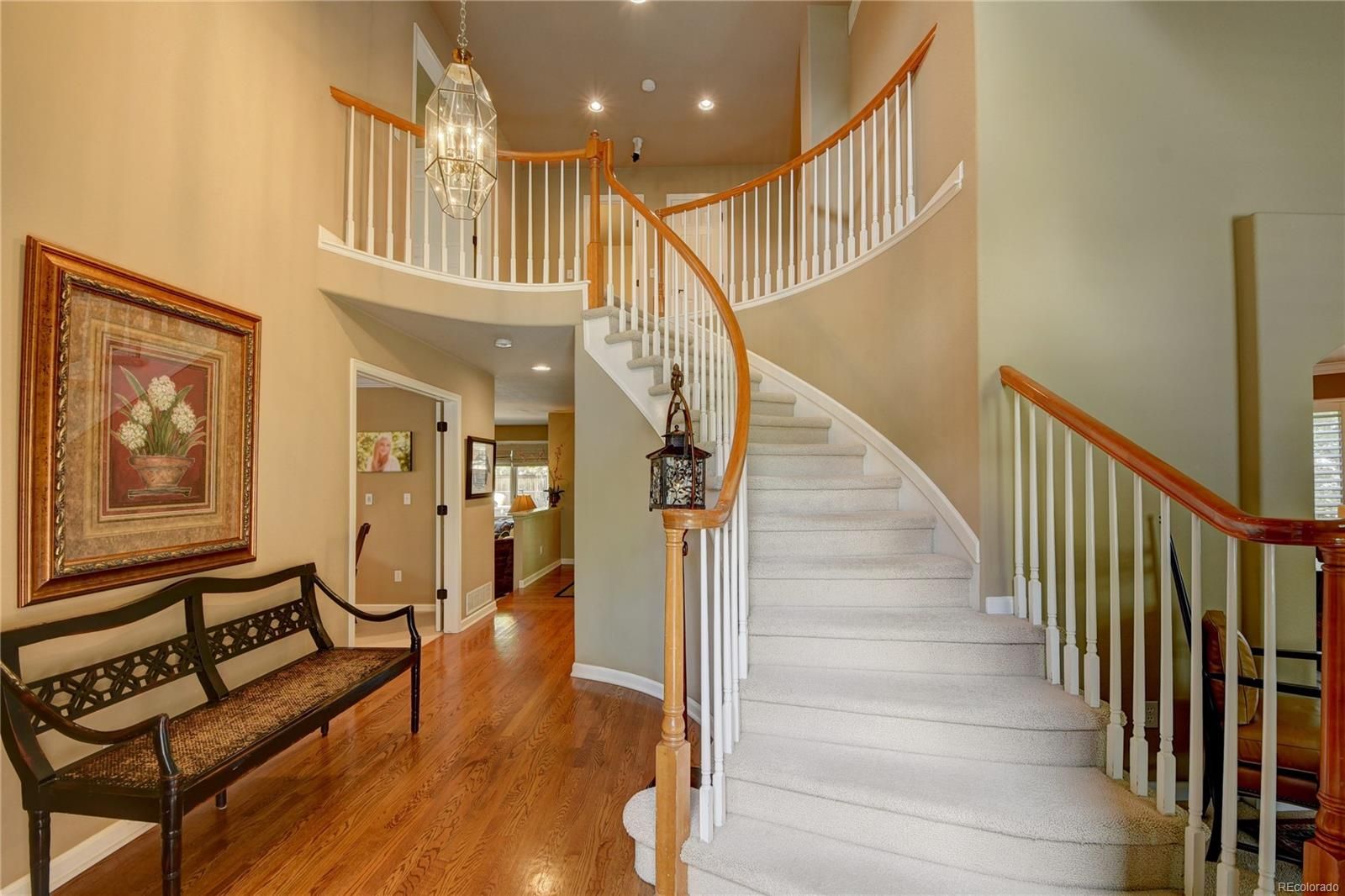 The same Highlands Ranch entry hall and staircase before the work