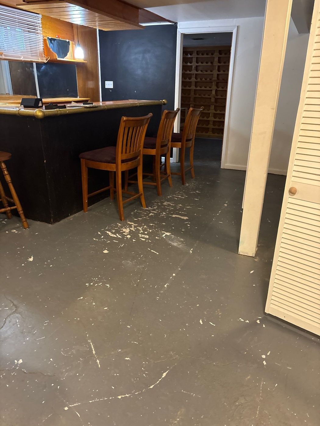 The same basement before, with bare concrete