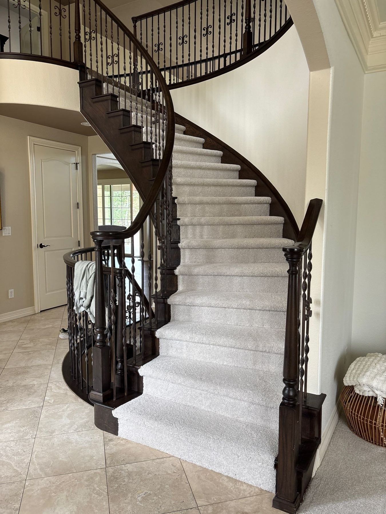Curved staircase in Lone Tree with new light gray carpet