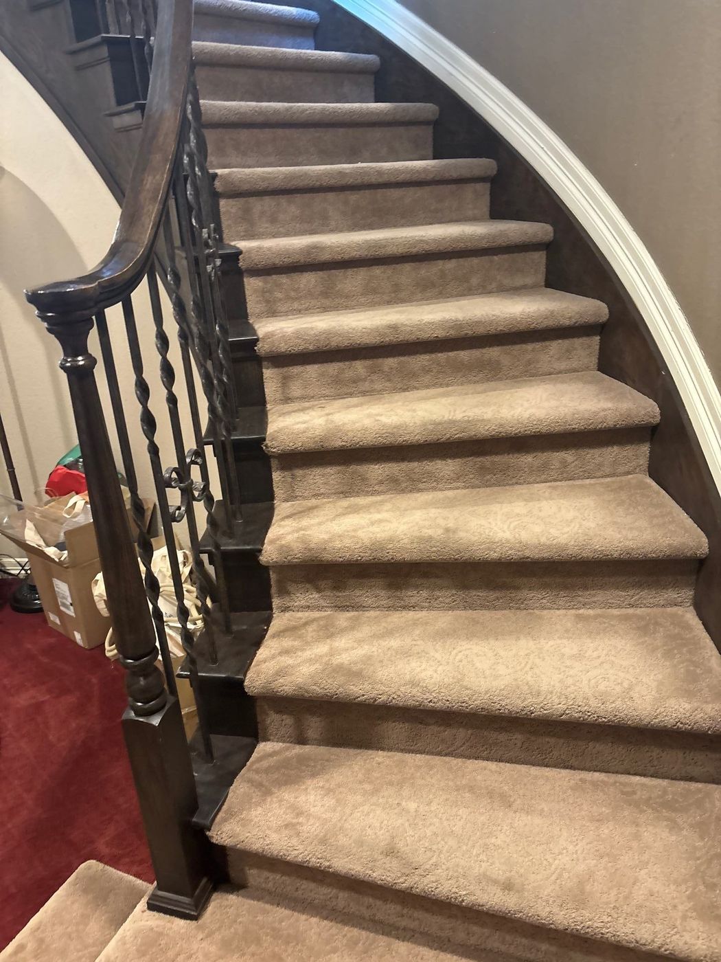 The Lone Tree staircase before, with worn beige carpet